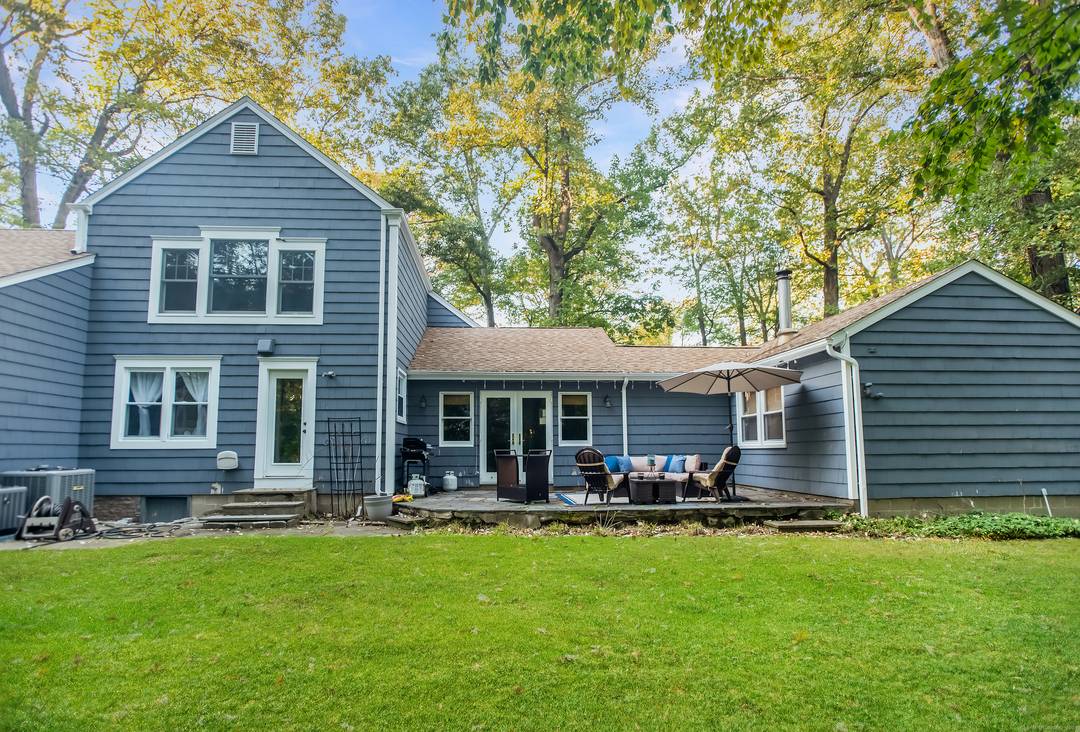 Welcome Home to this beautifully expanded and updated Cape Cod Contemporary home in desirable South Ridgefield !