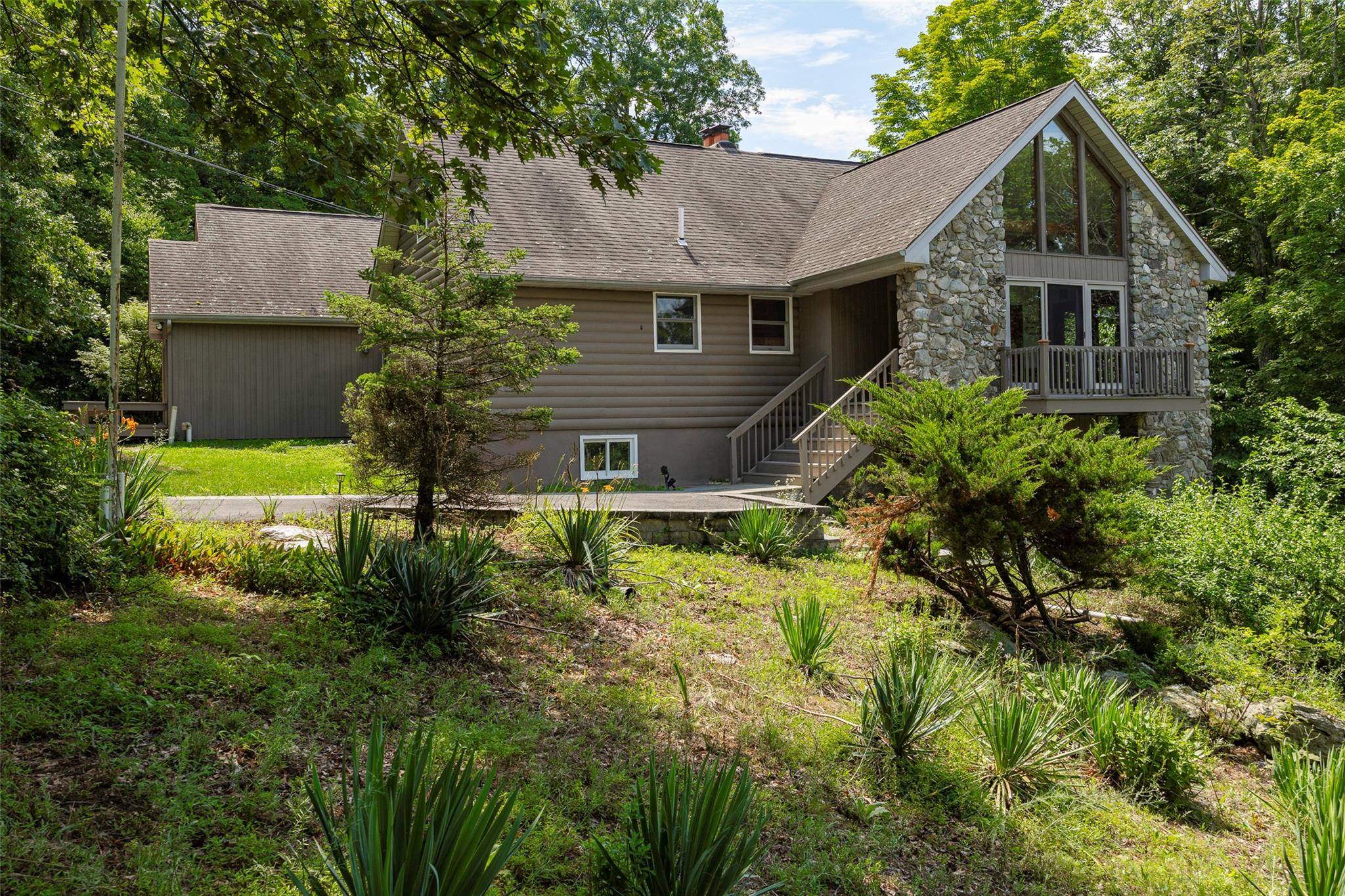 Tucked away on over 14 acres of total privacy and tranquility, 12 Wolf Lane is a contemporary retreat offering 4, 000 square feet of beautifully designed living space and every ...
