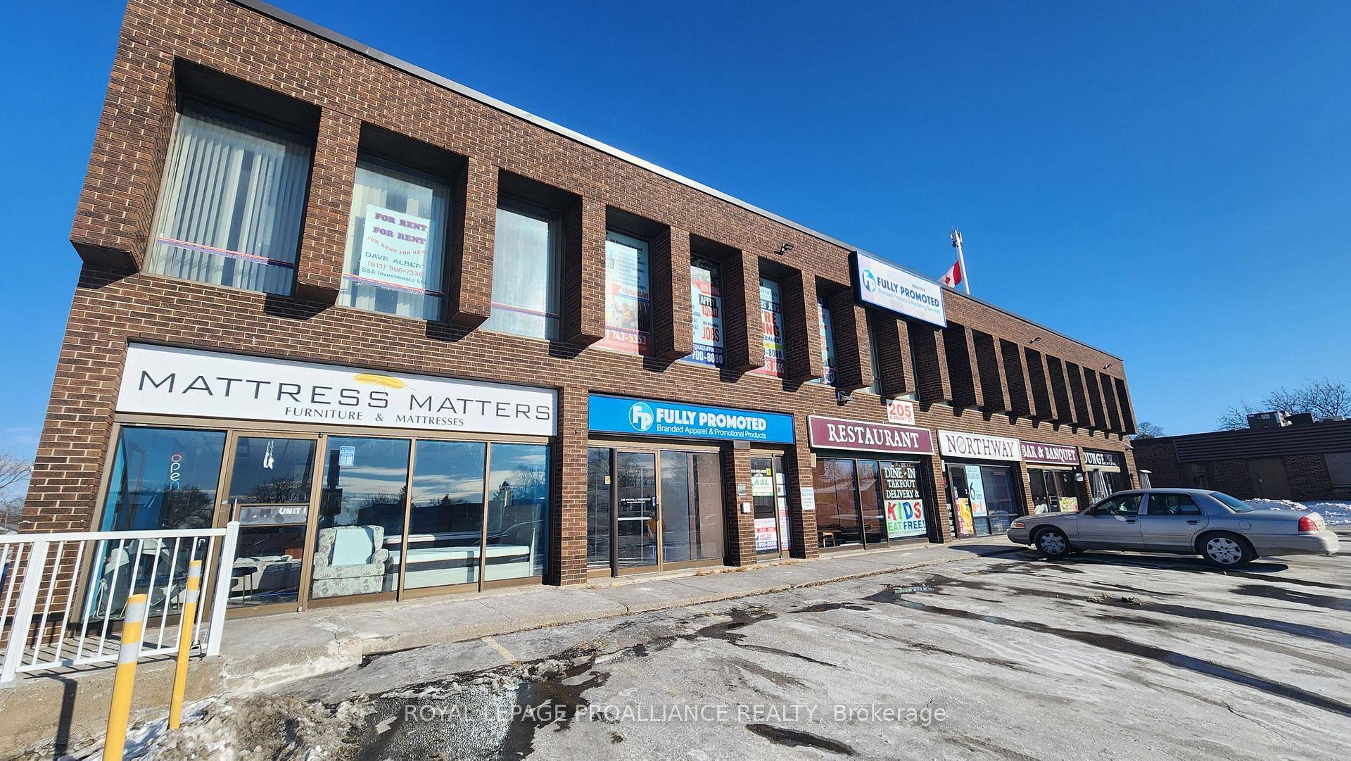 Bright, open fitness space featuring durable laminate flooring perfect for a gym, yoga studio, dance studio, or wellness center.
