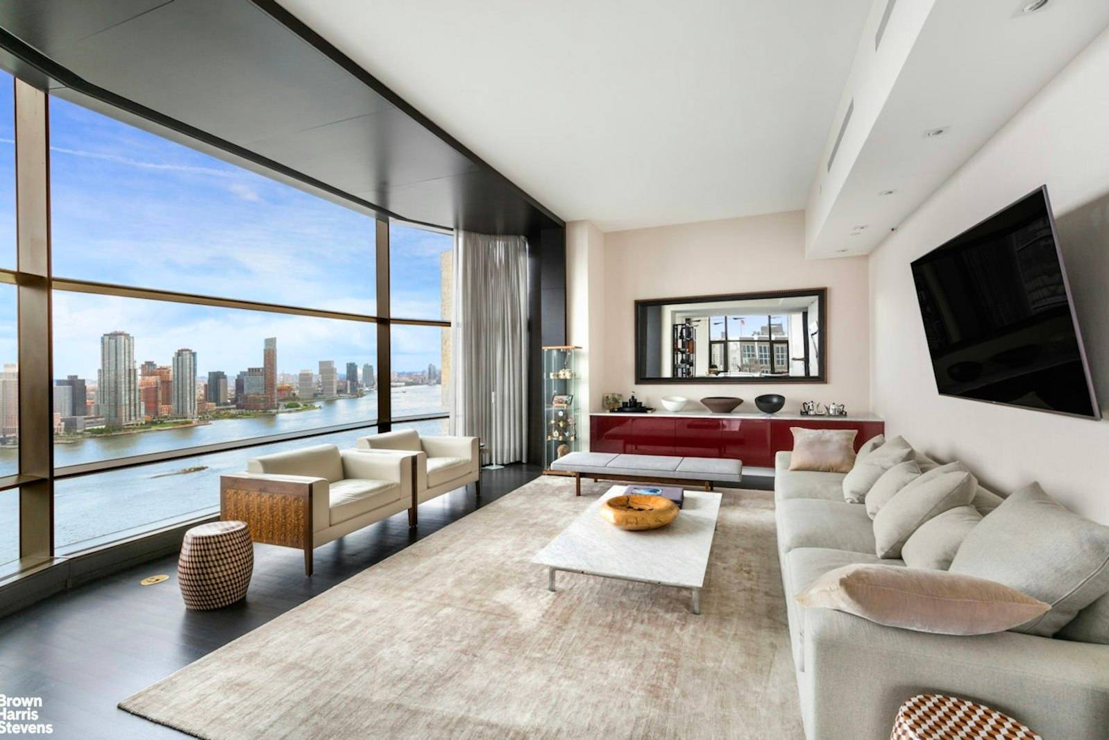 A luxurious custom designed 3 bedroom condo with sweeping views of the river and skyline.