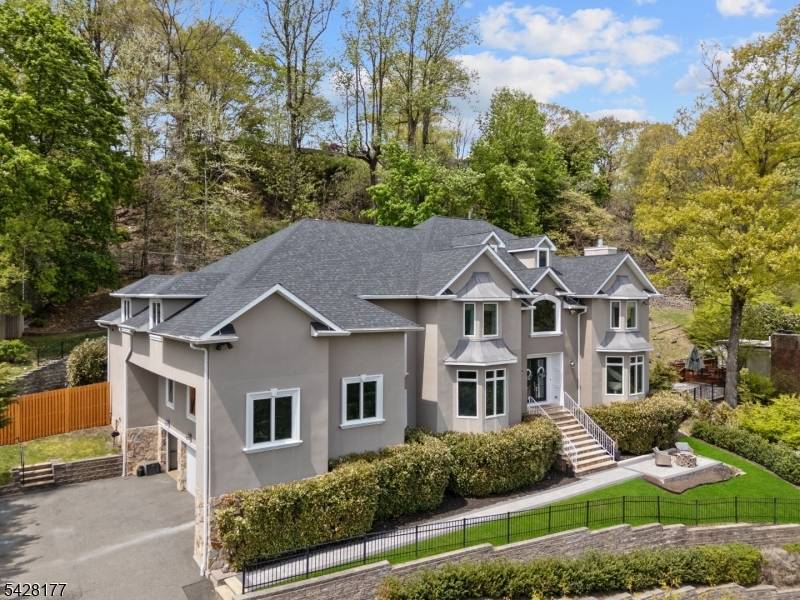 An exceptional custom residence designed for designed for those who value space, scale, and elevated living, this home offers expansive living across every level complemented by sweeping NYC skyline views ...