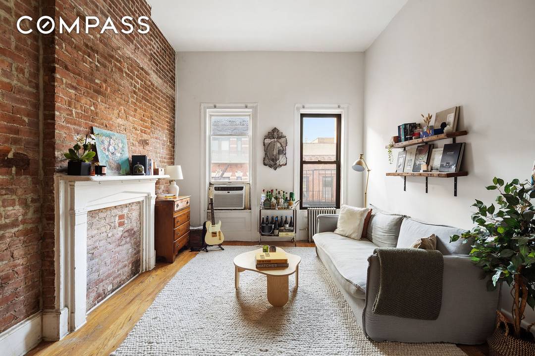 An idyllic lofted studio with 12' high ceilings, set on the top floor of a laid back Soho walk up.