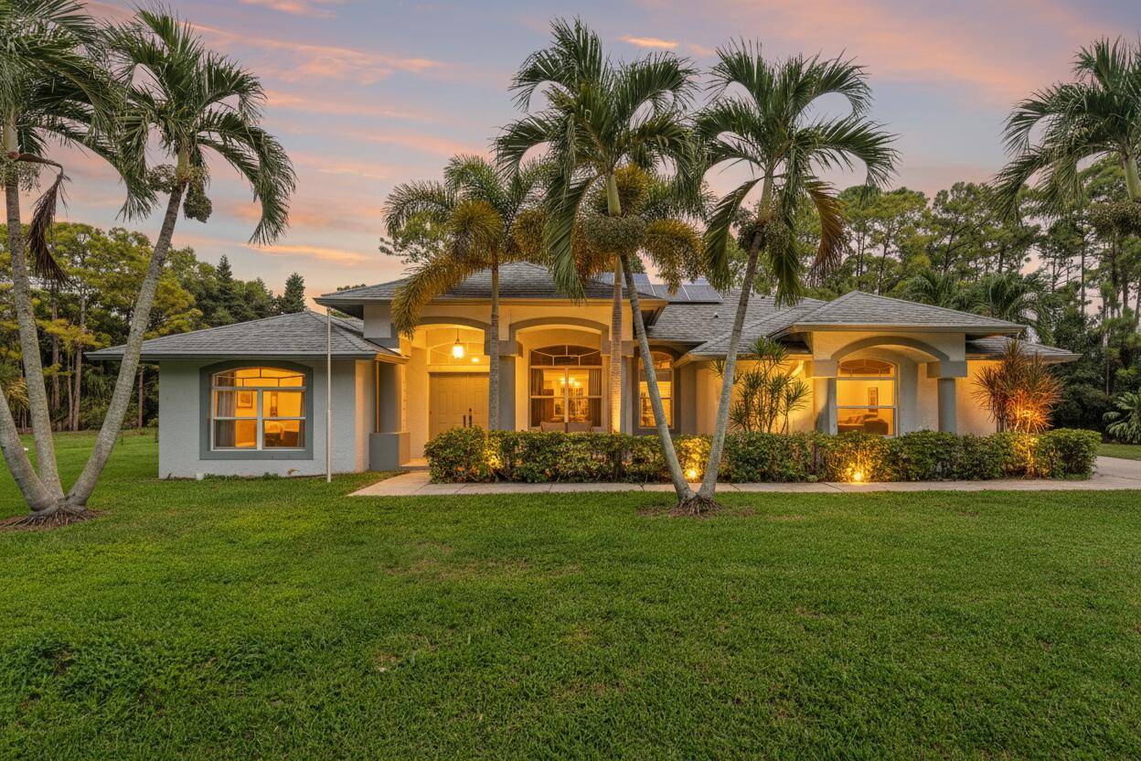 Escape to your own private, sustainable sanctuary in Loxahatchee, where the dream of true Florida country living meets modern, energy efficient comfort.