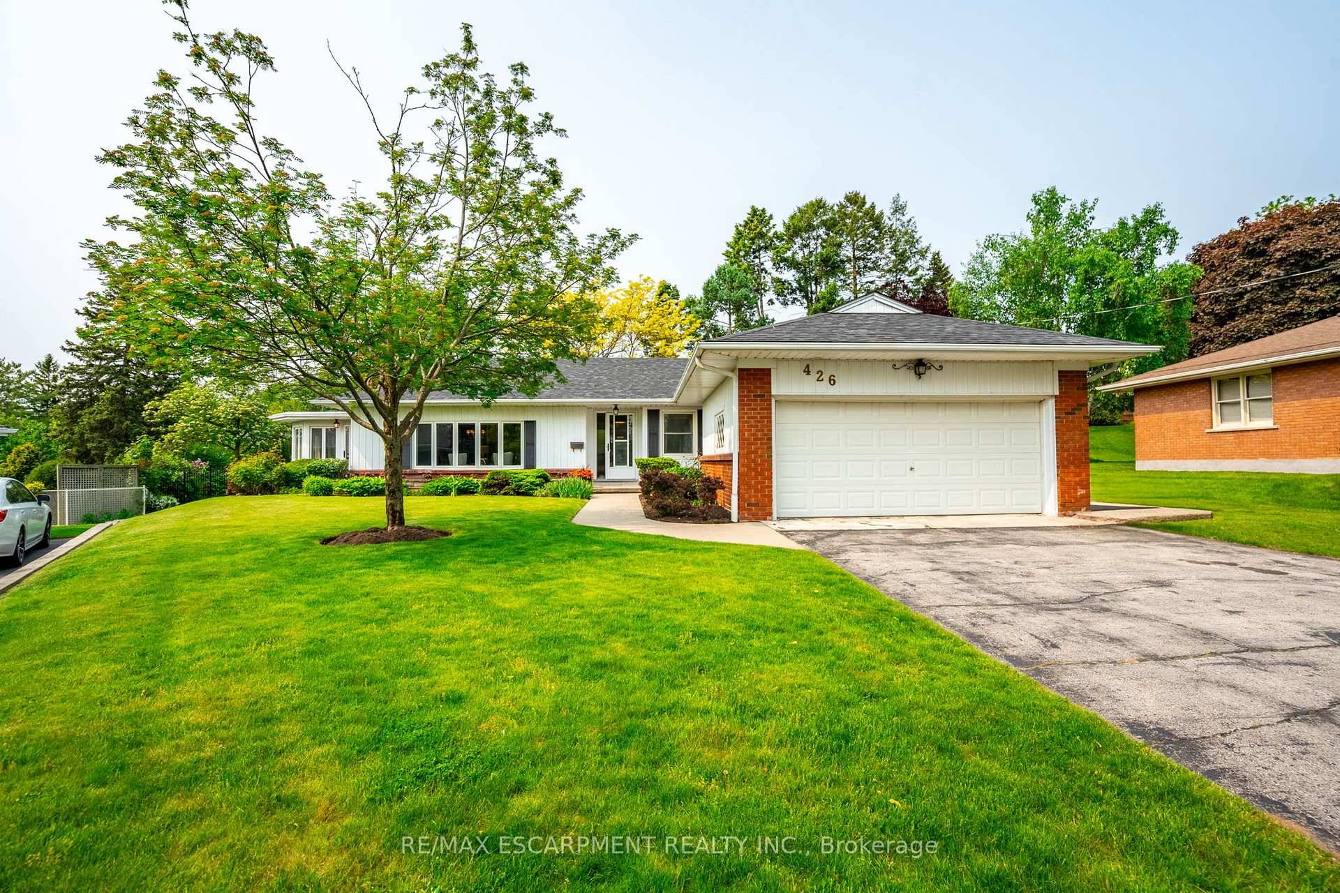 Nestled on one of the most picturesque lots in the area, this charming bungalow is a rare opportunity to own a well loved, custom built property with endless potential.