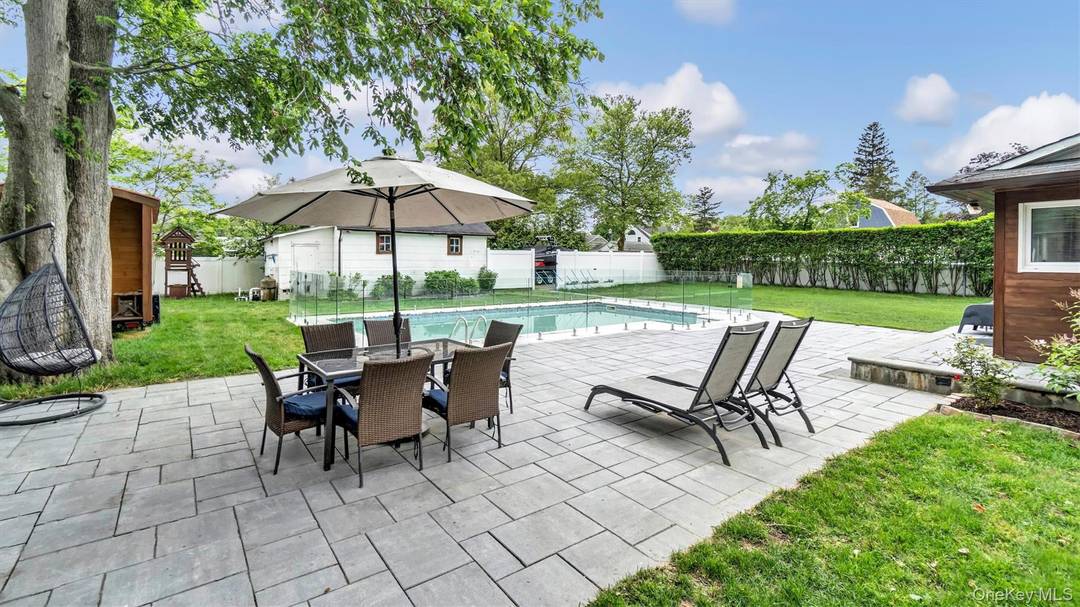 PRICE REDUCTION ! ! ! 143 Hallock St, Riverhead NY, where comfort meets luxury in an alluring dance.