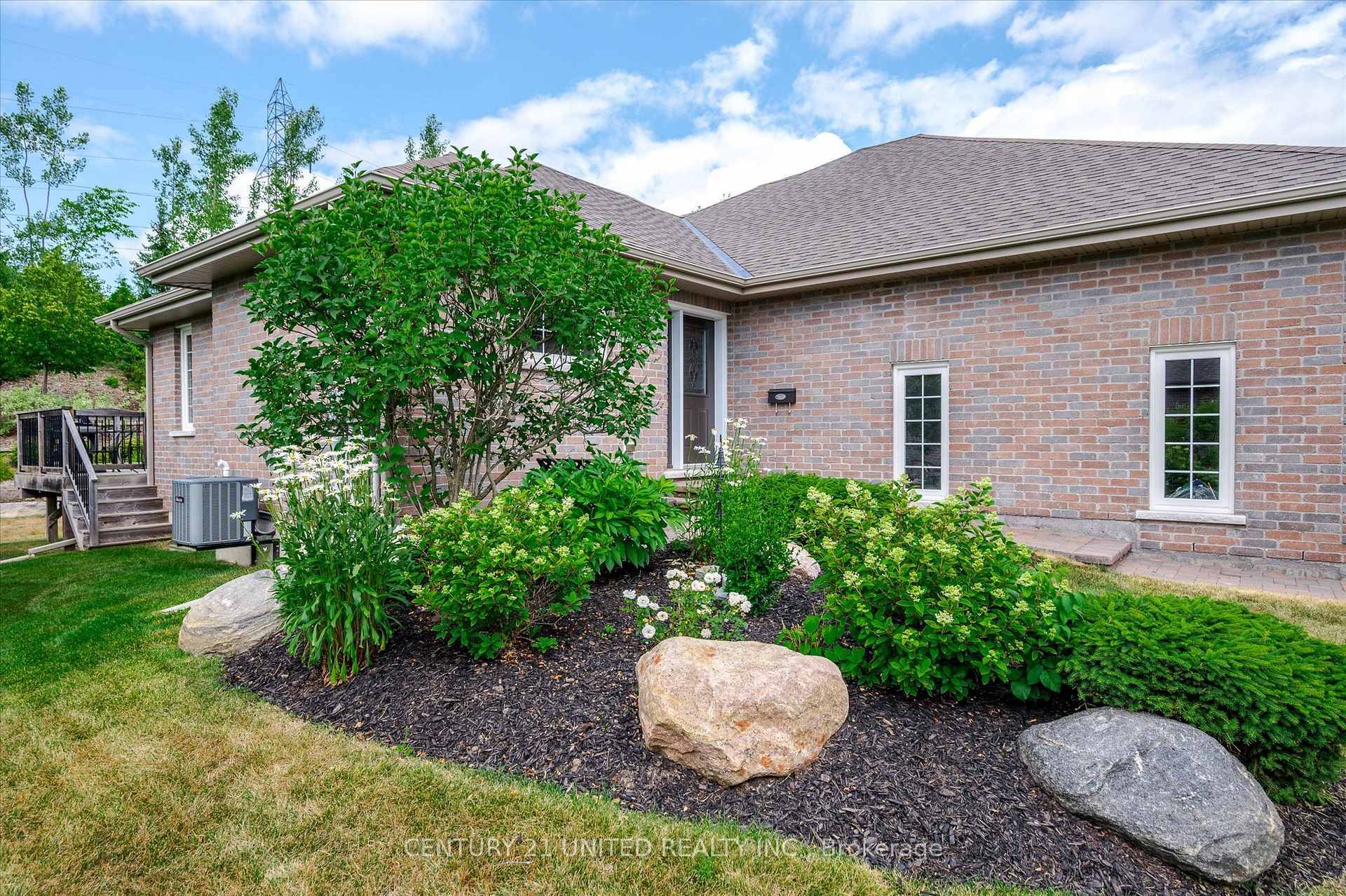 Big, bright, beautiful end unit backing onto terraced gardens in the newest section of the Ferghana, a highly desirable condominium complex of well maintained properties.