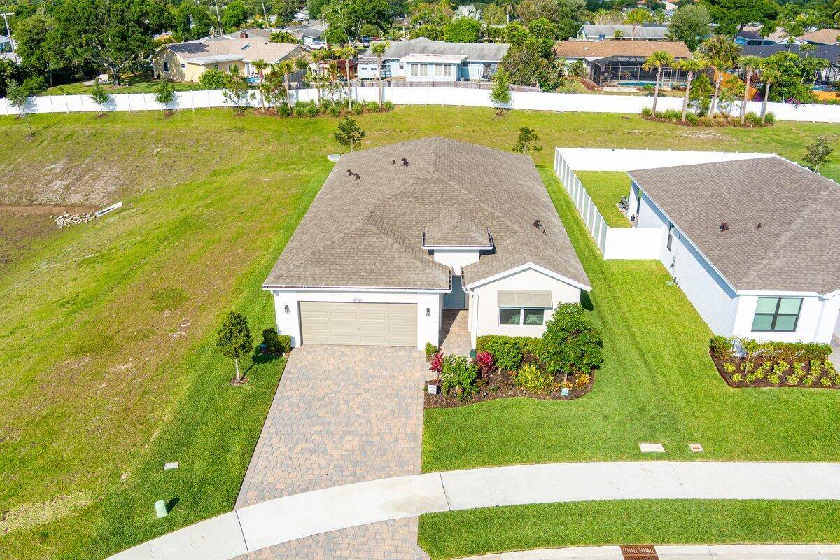 New construction Delray model in the quiet gated community of Sabal Pointe.