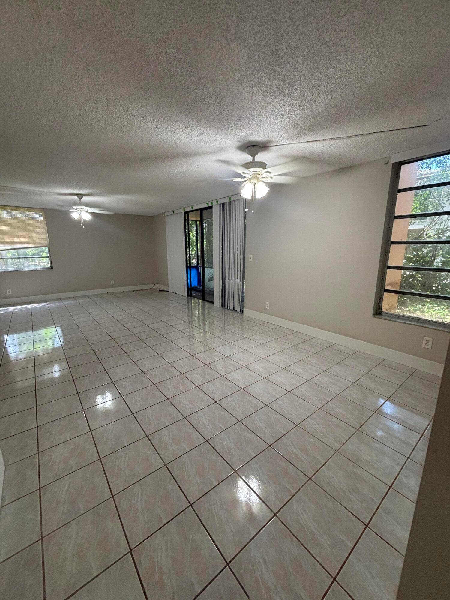 CASH ONLY, SOLD AS IS. Spacious 2 bed 2 bath, 1st floor, corner unit in gated community, washer dryer inside, updated kitchen, screened patio.
