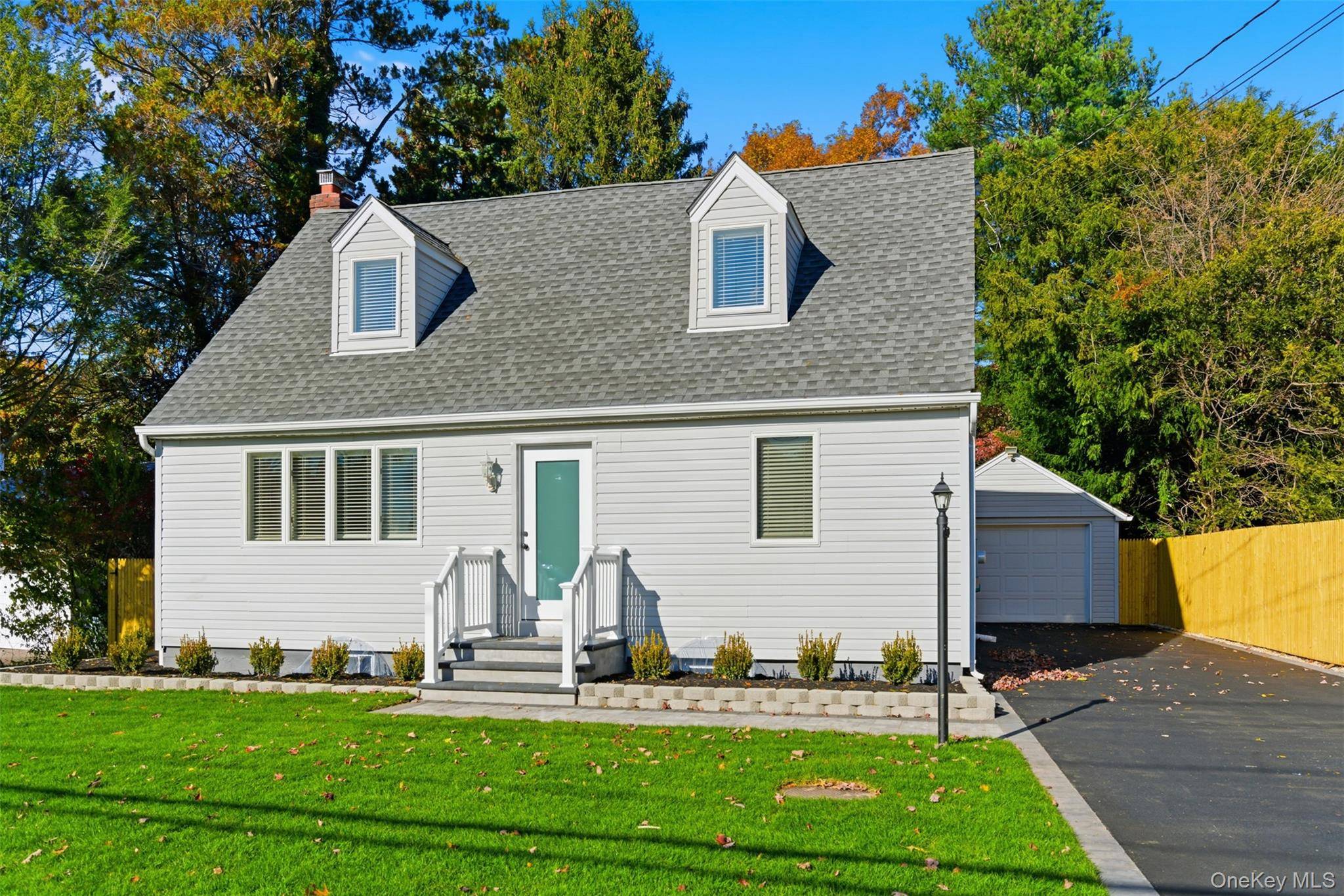 2025 Fully updated Cape offering modern design and effortless living in heart of Huntington Station.