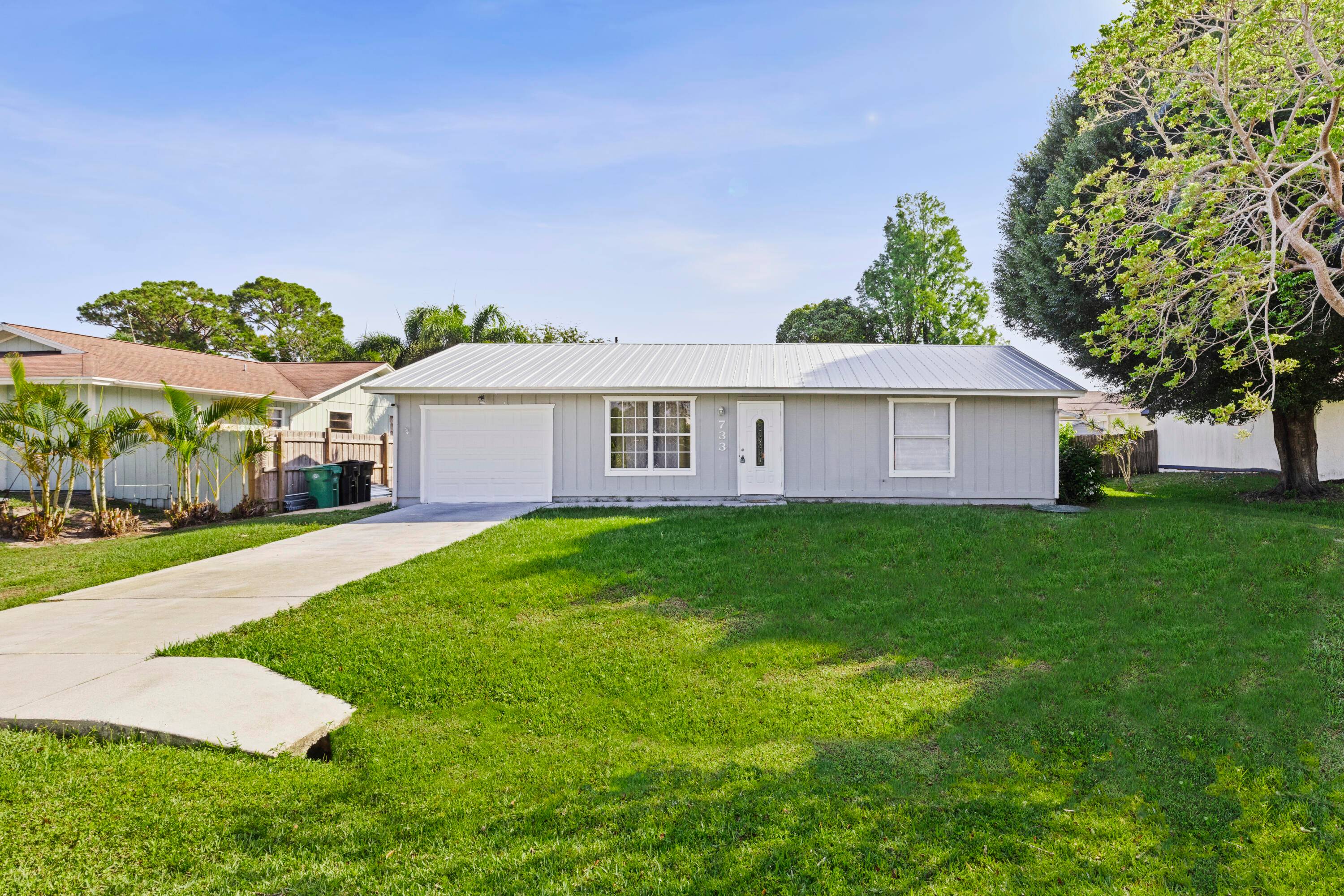 Welcome home to this charming 2 bedroom, 2 bathroom residence with a 1 car garage, located in the heart of Port St.