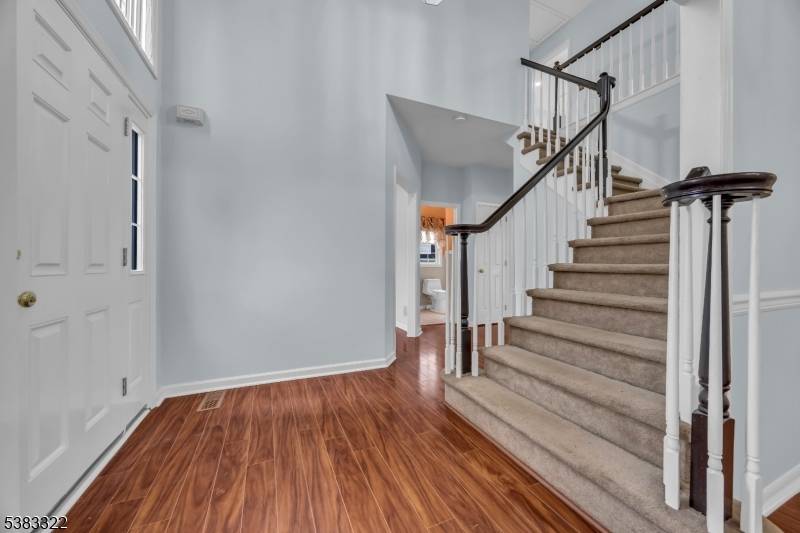Welcome to this charming custom Colonial set on a quiet street in desirable Cardinal Woods in Raritan Boro, offering 4 spacious bedrooms and 2.