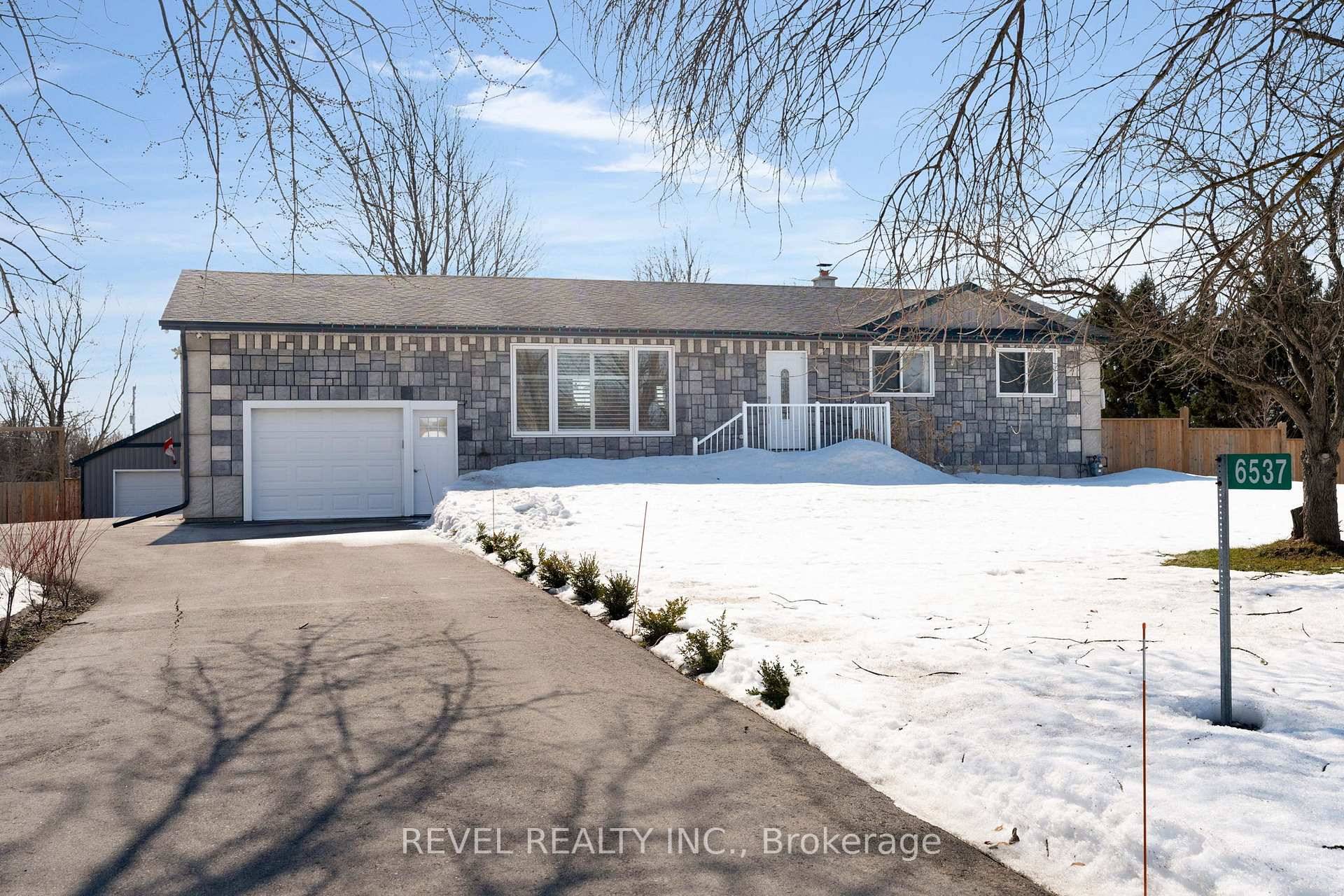 This breathtaking property offers peaceful, private living while being surrounded by picturesque farm fields and mature trees.