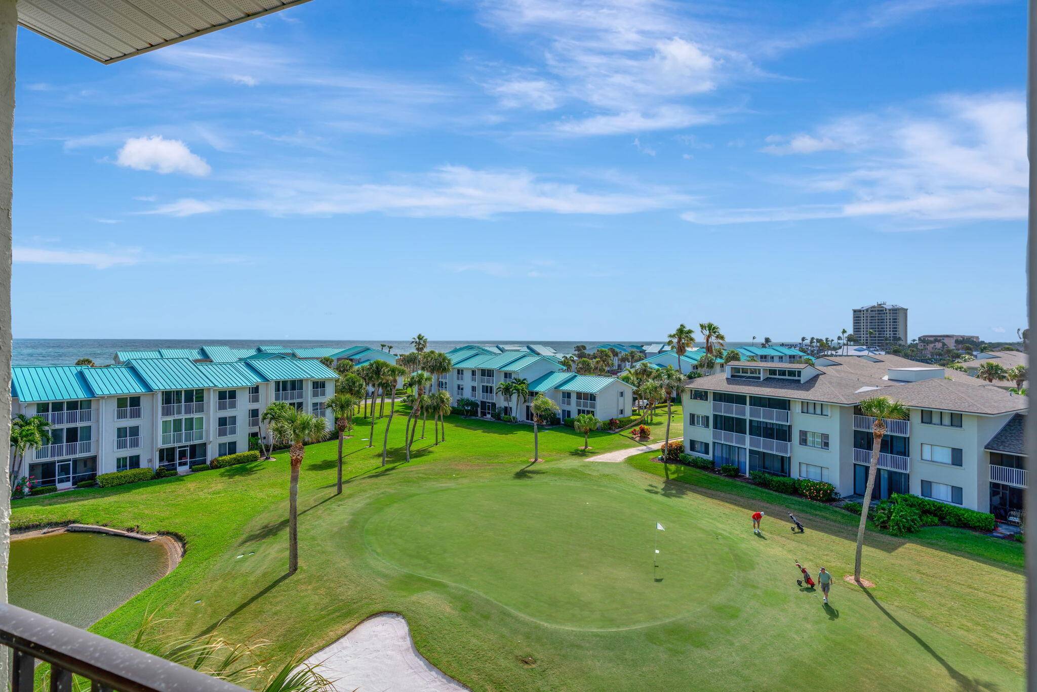 Upgraded top floor unit with ocean, golf course pond views.