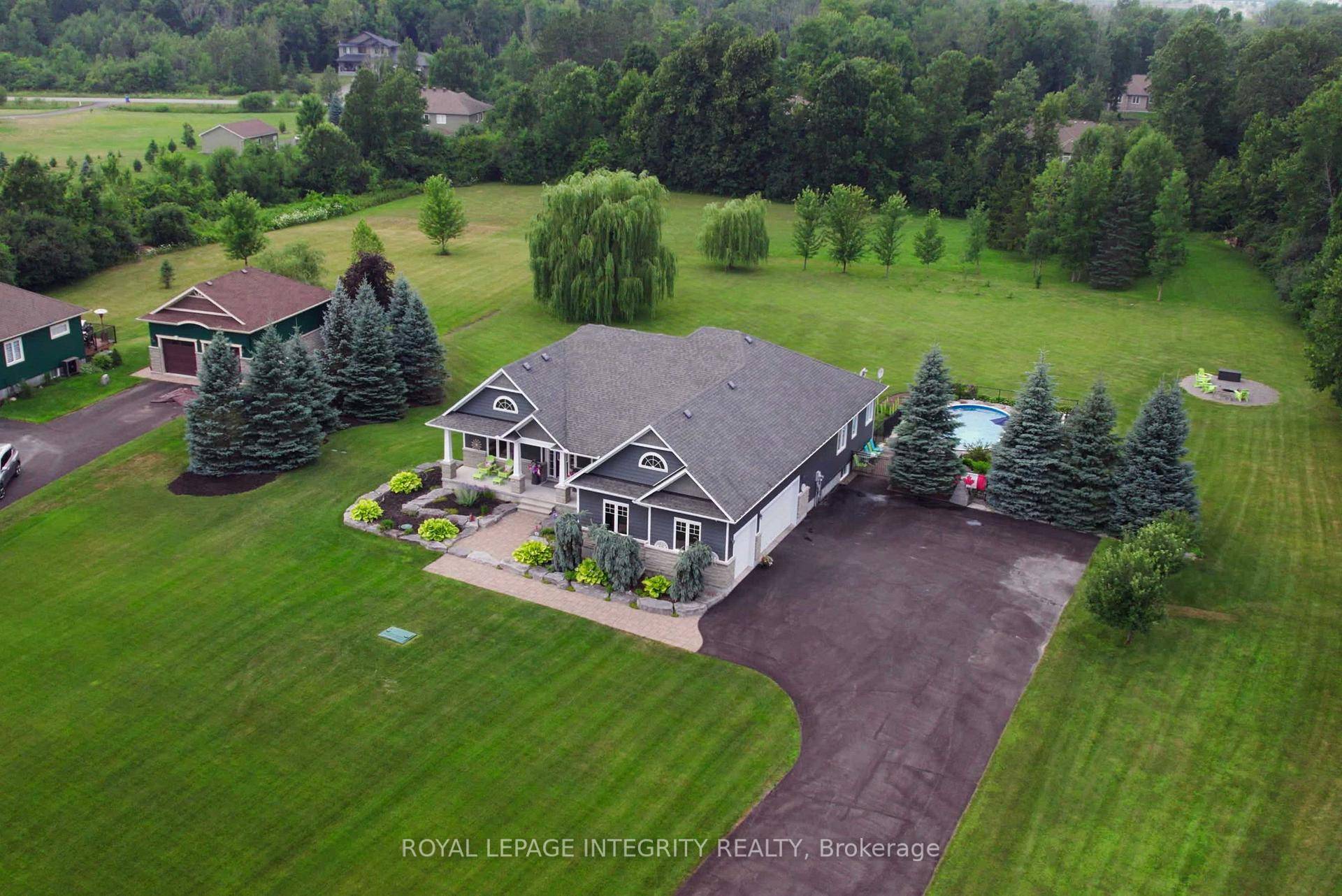 This stunning property offers a luxurious living experience on a beautifully landscaped 1.