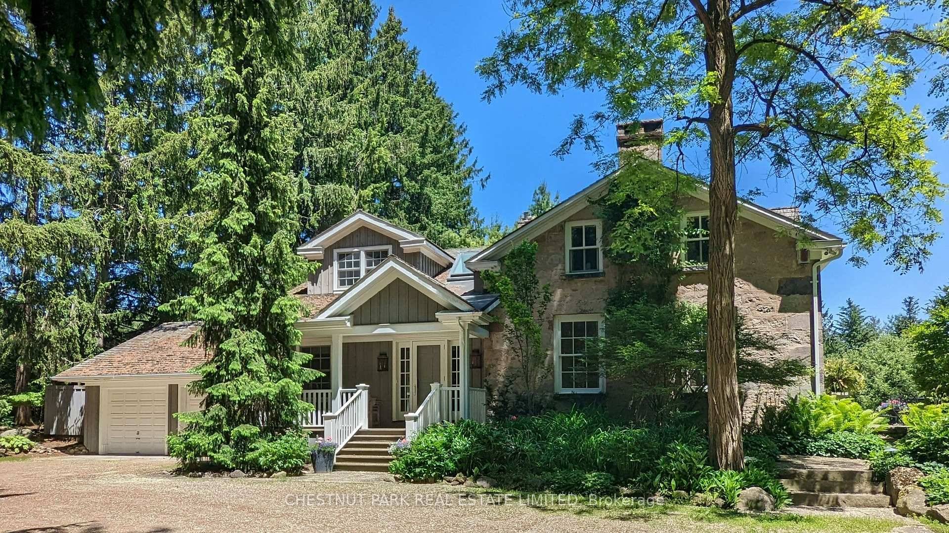 Set well back from the road, this elegant stone home is nestled in complete privacy.