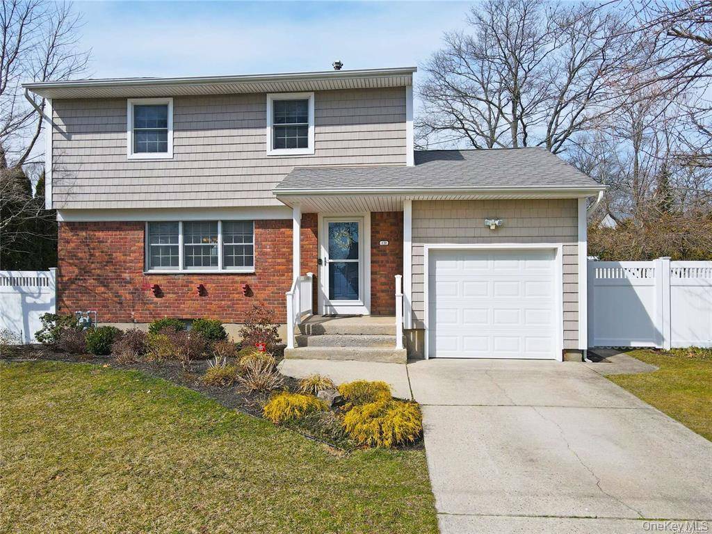 Stunning three bedroom Colonial showcasing gleaming hardwood floors throughout, central air conditioning, and upgraded electrical.