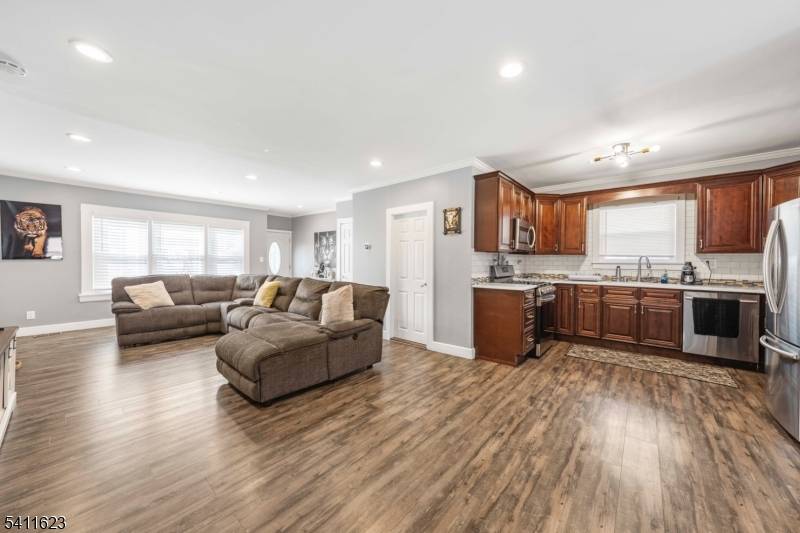 Welcome to this beautifully renovated two family home, offering modern amenities and classic charm.