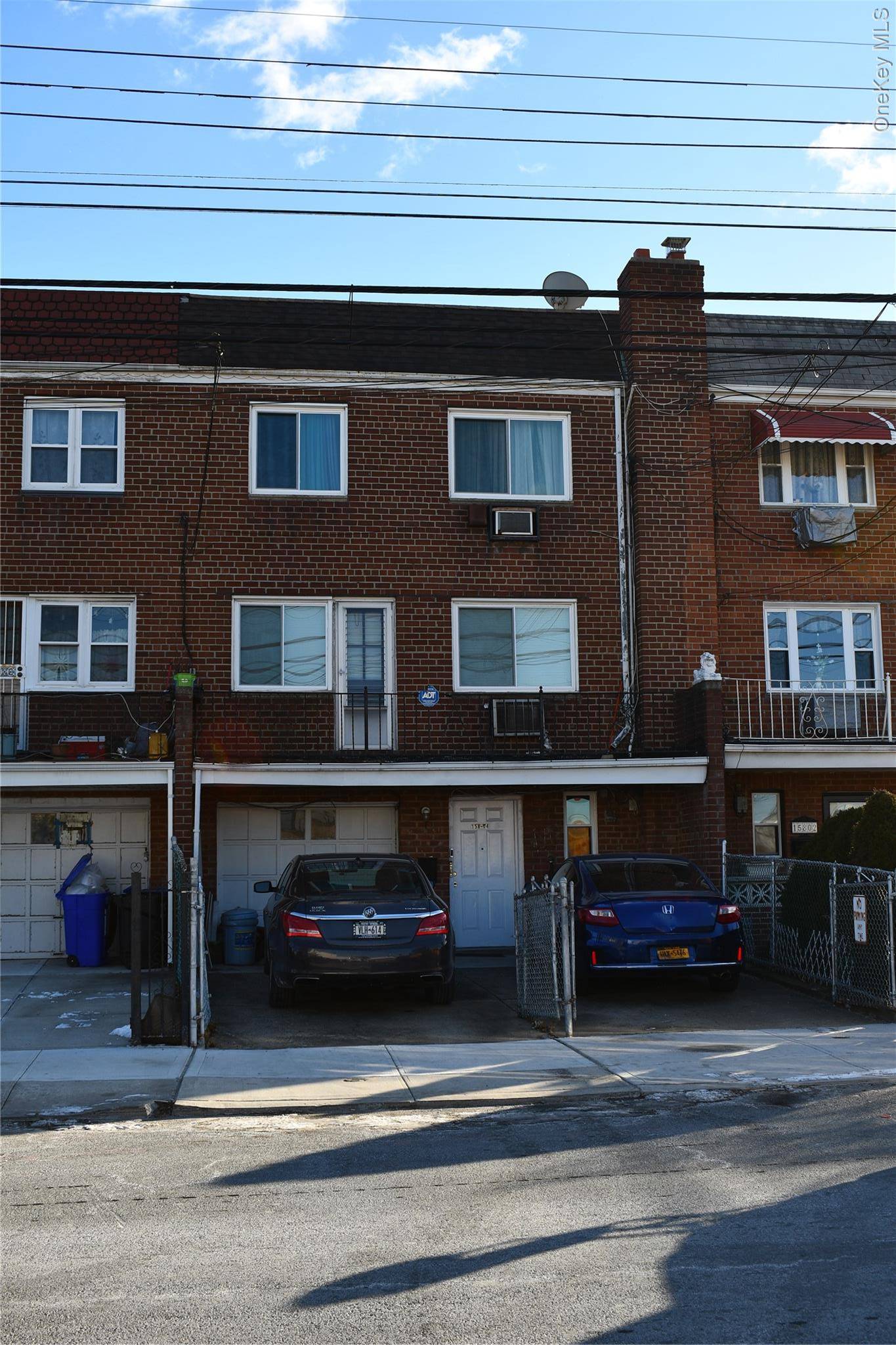 All Brick 2 family in Jamaica Hills with walk in private driveway and 1 car garage.