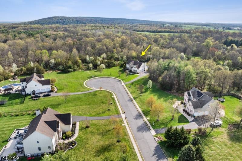 Built in 2012 and just moments from town, this exceptional Northeast facing estate is set on 2 fenced acres at the end of a cul de sac, among other fine ...