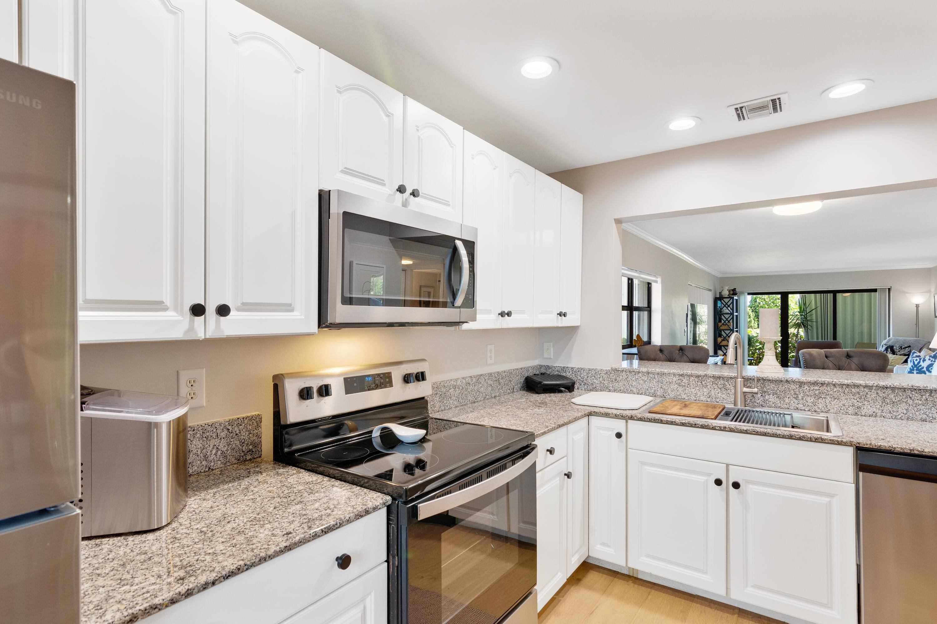 CORNER UNIT ! FIRST FLOOR WALK OUT TO YOUR YARD !