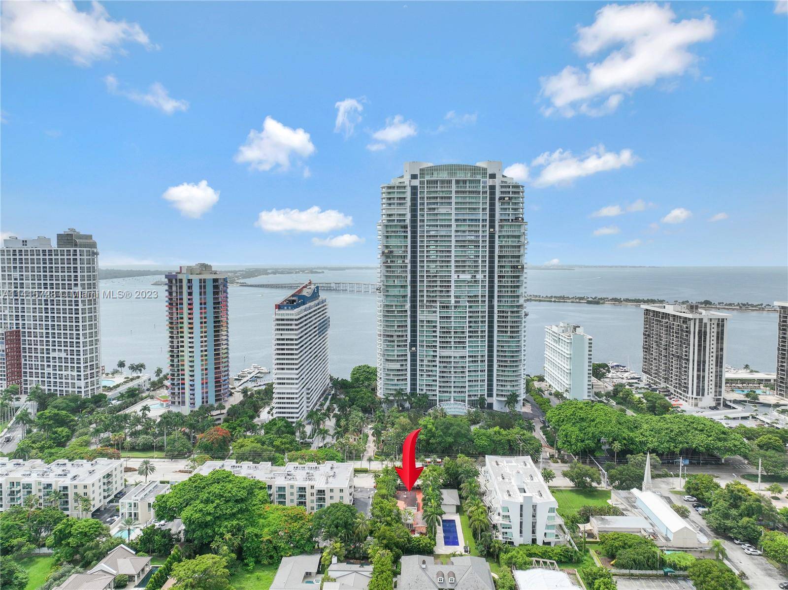 A cozy 3 bedroom, 2 bathroom house in Brickell Ave, This charming and comfortable property features a sparkling pool, a patio, and a fenced backyard.