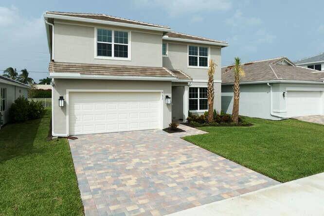 Windsong Estates sits elegantly on the right, just past the Wellington line in Lake Worth, FL, a gated gem by DiVosta.