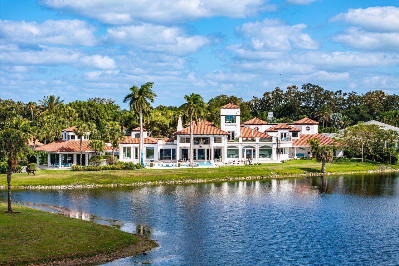 Proudly offered on a premium one acre double lot this stunning estate delivers over 12, 000 sq.