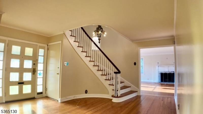 Spacious brick home blending vintage charm with modern updates, just 15 minutes from NYC and near Routes 20, 80, 21 46.