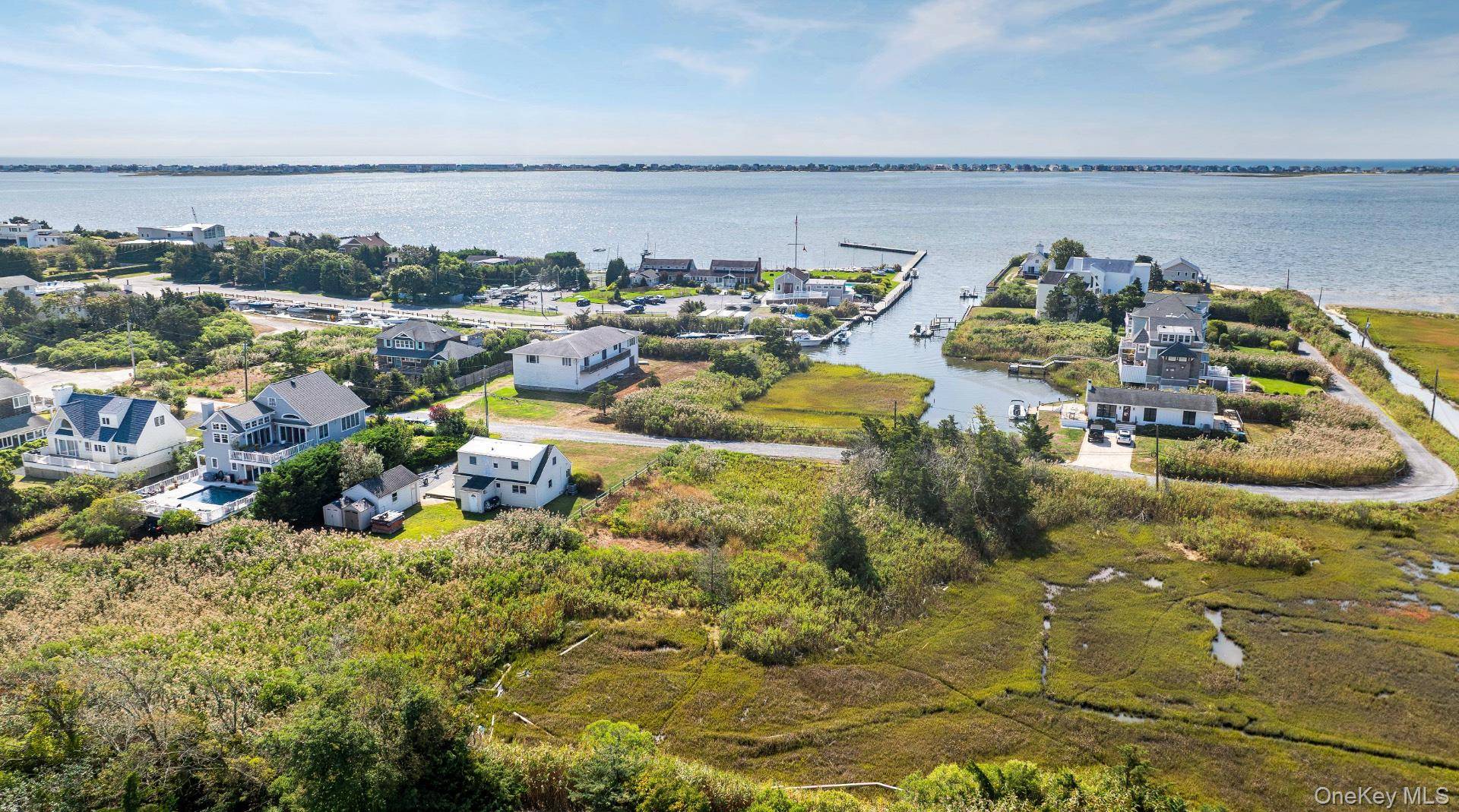 HAMPTON'S WATERFRONT LANE NEW ON MARKET Nestled in a tranquil waterfront setting in the hamlet of Remsenburg, this wonderful.