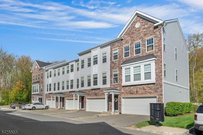 Welcome to this beautifully maintained townhome on sought after Devon Lane in The Hills, quietly tucked away on a quiet cul de sac with just a handful of homes.