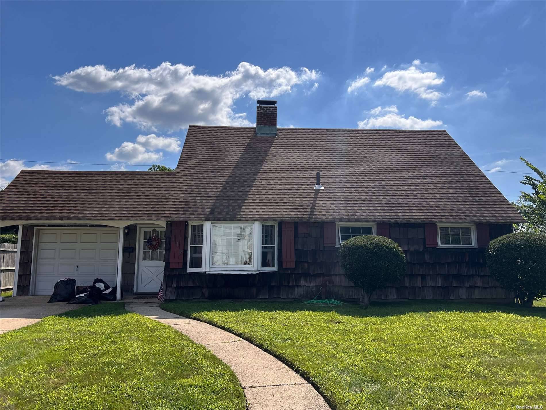 Run, don't walk to the Best priced home on the market in Island Trees School District !