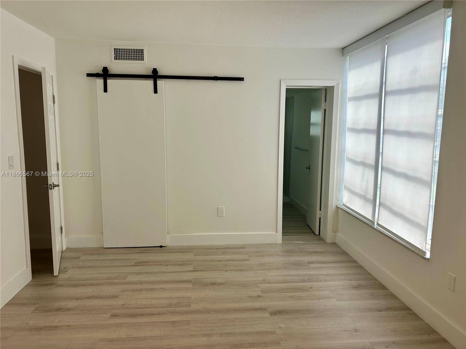 Remodeled corner unit with lots of light at Bay Harbor Islands, with large Master bathroom with walk in closet, office second bedroom and visitors bath.