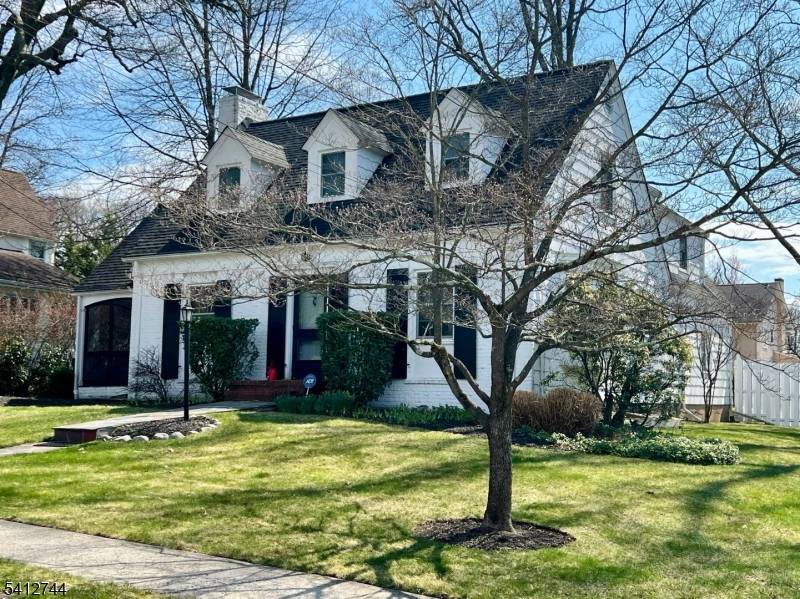 This inviting Colonial Cape offers classic charm from the start, with its brick front and staggered wooden shingles for maximum curb appeal.