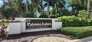 Paloma Lakes, Coconut Creek gated community, very Nice Corner Townhome featuring an open family room dining room, a large kitchen with wood cabinets and granite counter tops 3 bedrooms, 3 ...