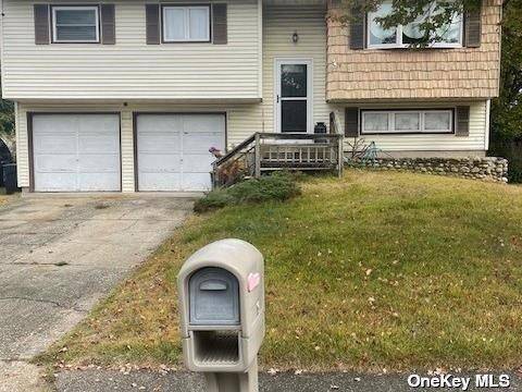 Nice Large Hi Ranch, This Home has 4 bedrooms with one and half bathrooms, Eat In Kitchen, family room, living room dining room, 2 large car garage, very large back ...