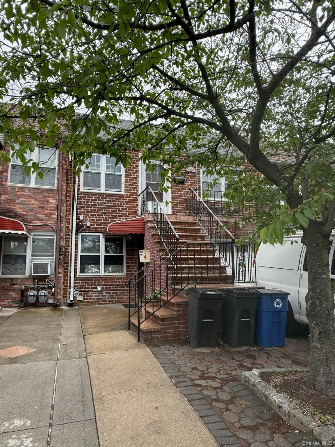 Attached 2 family brick home in Auburndale Flushing.