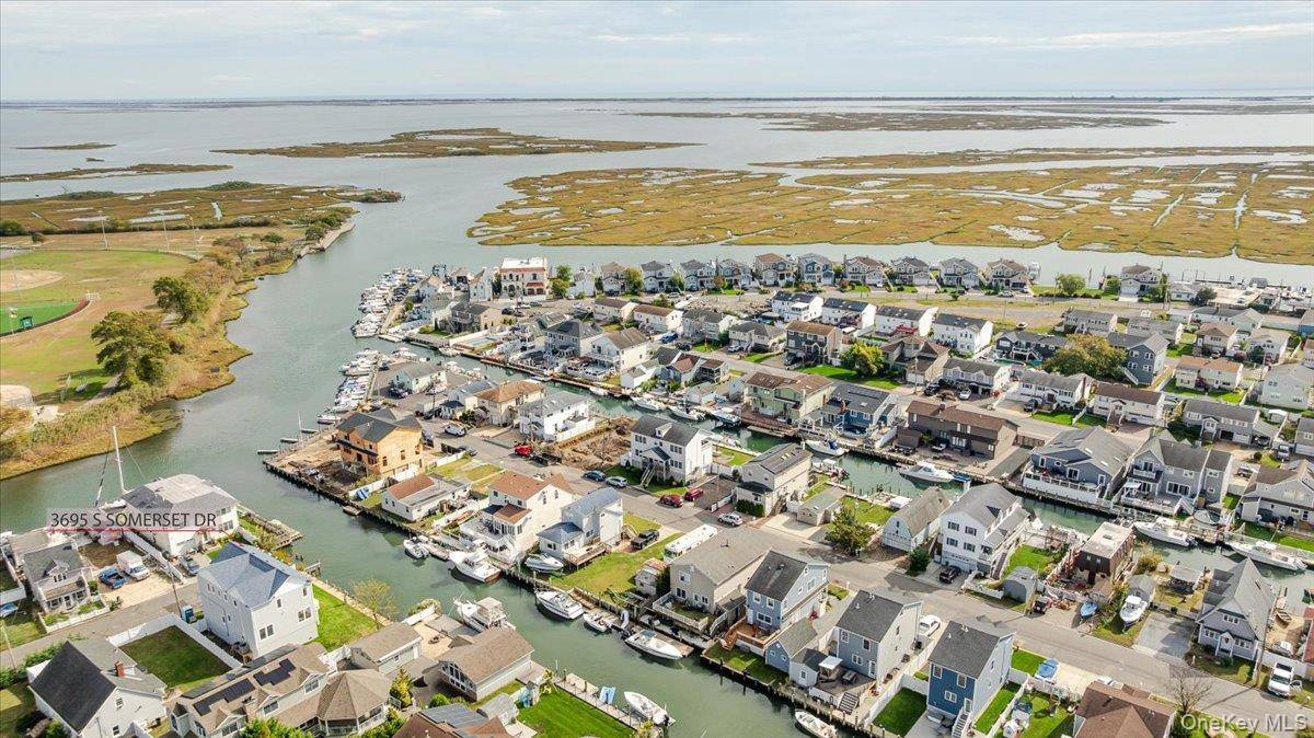 Welcome to this exquisite newly built Colonial by OZ General Contracting, a stunning three level waterfront home offering 90 ft of brand new PVC bulkhead with direct canal access and ...