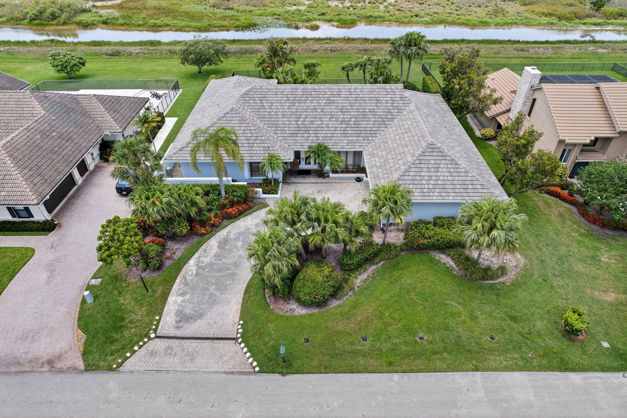 31 Dunbar Rd is an exclusive pool home in the prestigious Marlwood Estates of PGA National.