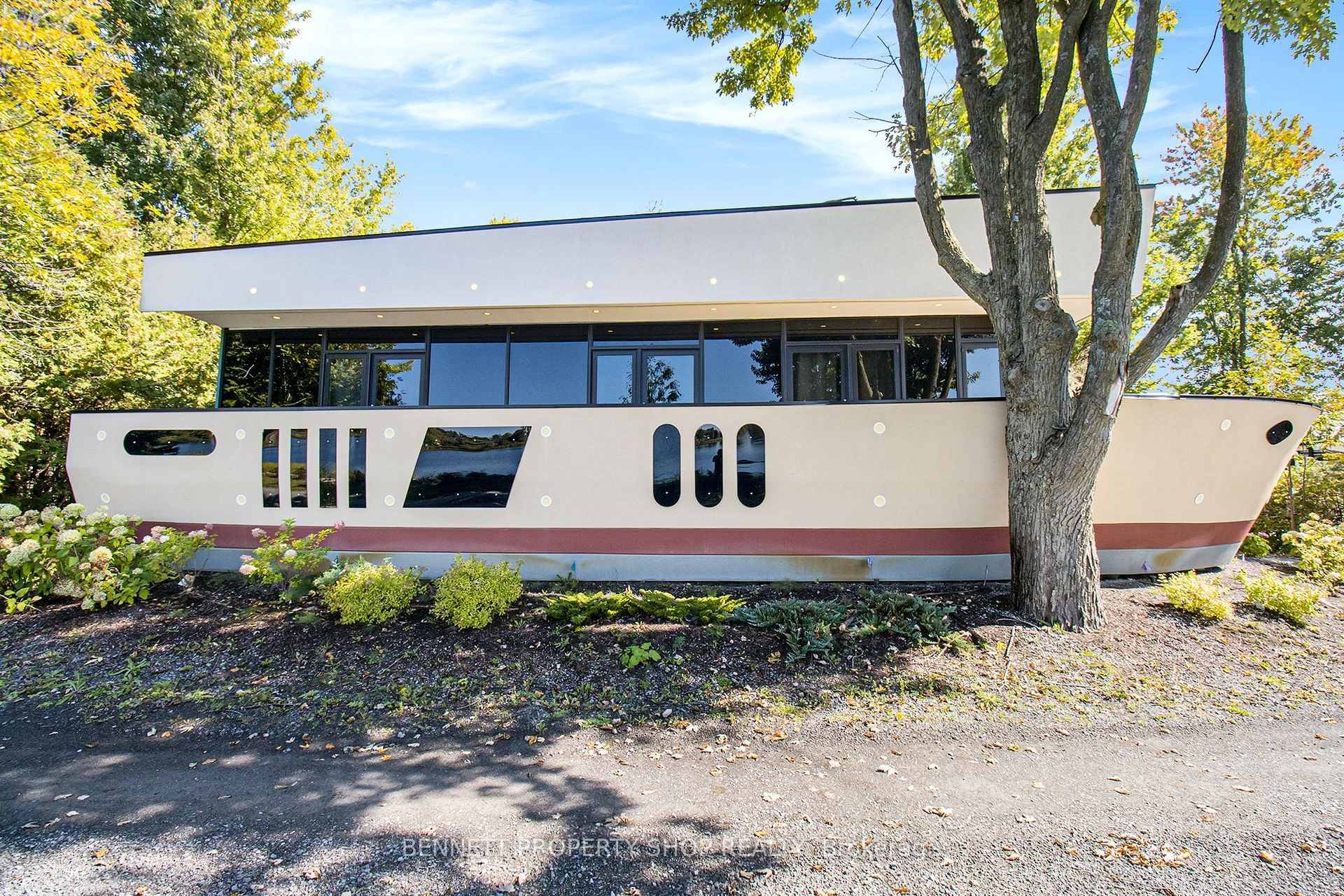 Escape to serenity at this stunning boathouse style retreat, nestled on over 100 feet of pristine waterfront along the tranquil Rideau.