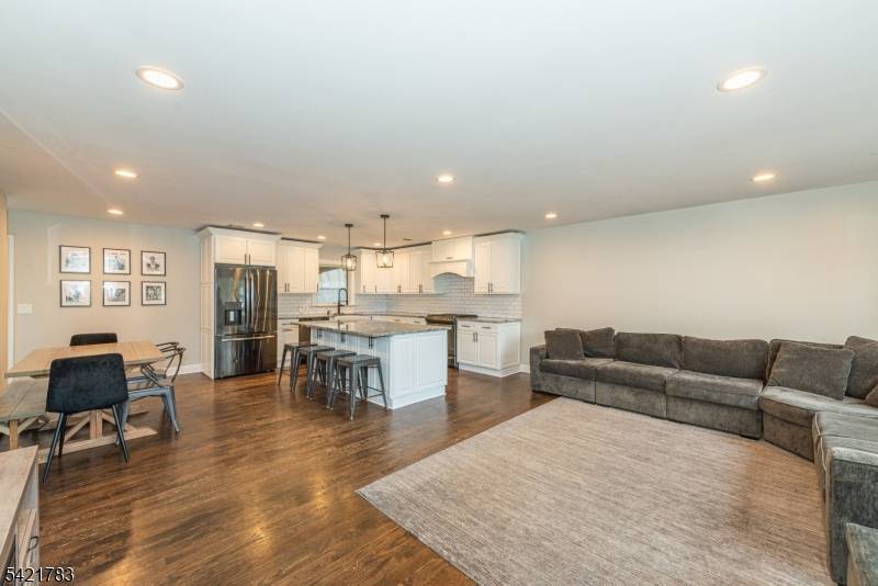 Beautifully renovated 3 bedroom, 2 full bath, ranch style home with open floor plan, outstanding designer kitchen with granite countertops and stainless steel appliances, huge center island with breakfast bar, ...