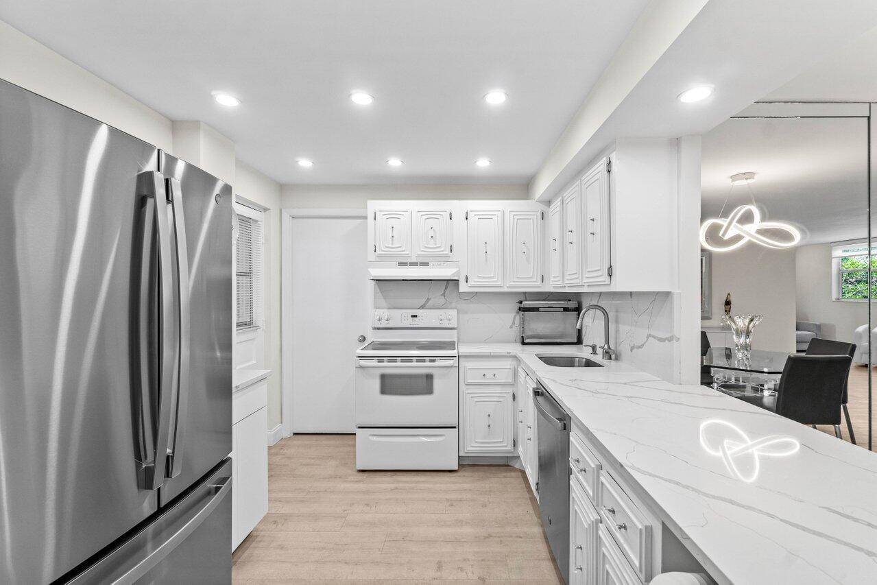 Welcome to your perfect slice of paradise in East Boca !