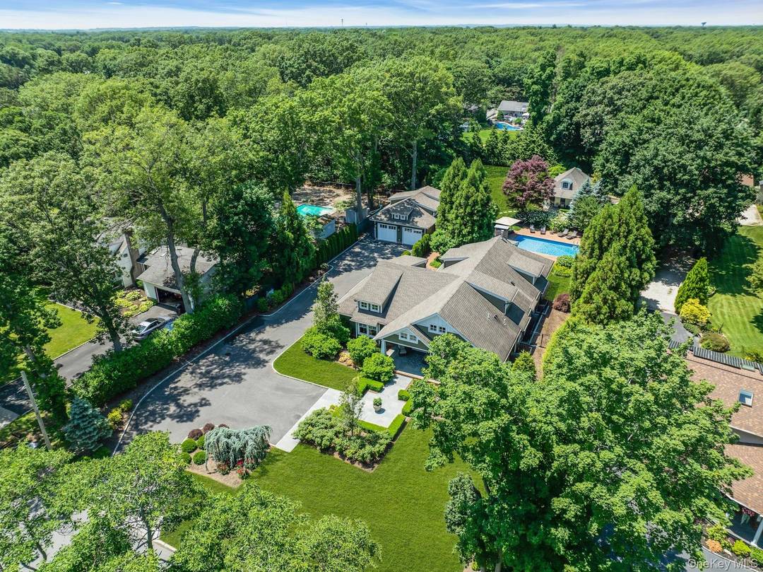 Welcome to a unique compound, this stunning Craftsman home showcases an airy open concept layout with soaring ceilings and elegant rift and quartered oak flooring thoughout, known for its beauty ...