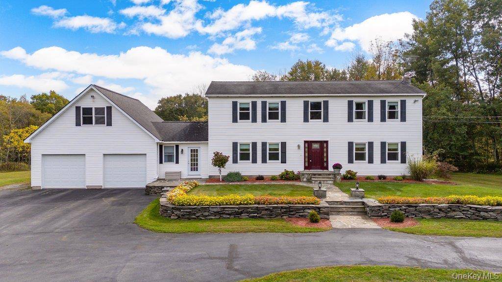 Welcome to this elegant Center Hall Colonial, nestled on a picturesque 4 acre parcel offering space, privacy, and timeless charm in the highly sought after Minisink School District !
