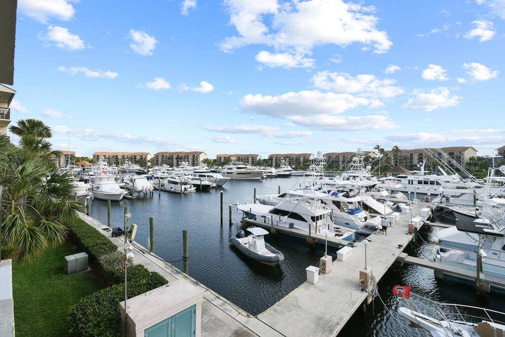 Beautiful 3rd floor corner unit with spectacular eastern views overlooking the marina and mega yachts.