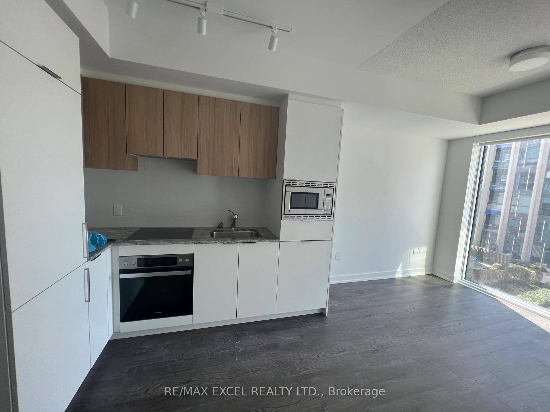 one bedroom suite featuring a spacious balcony, open concept layout, and modern finishes.
