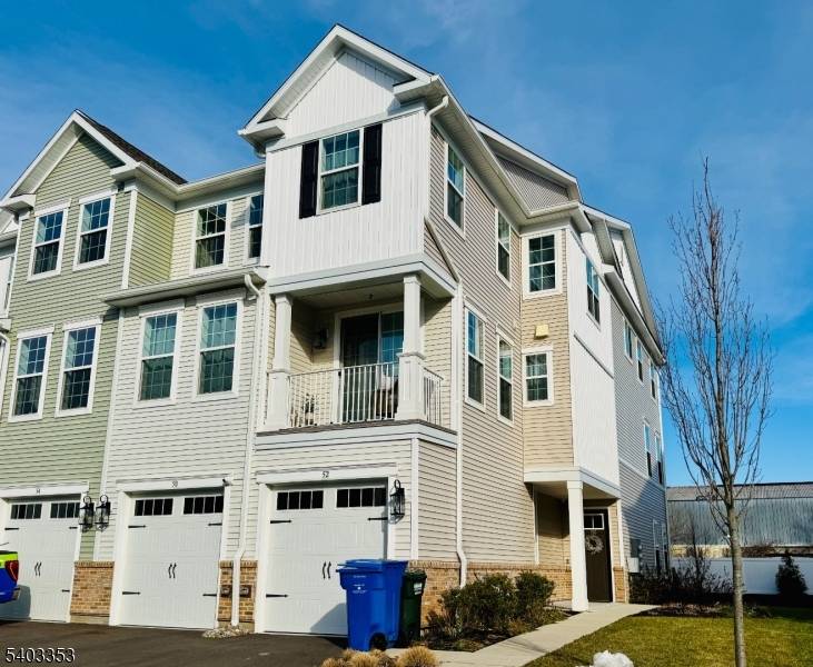 Welcome to this beautiful end unit townhome in the highly desirable Crossings at Dunellen.