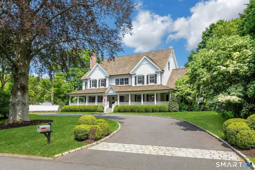 The moment you step onto the inviting front porch, you'll feel the warmth and charm of this exceptional 5 bedroom, 4.