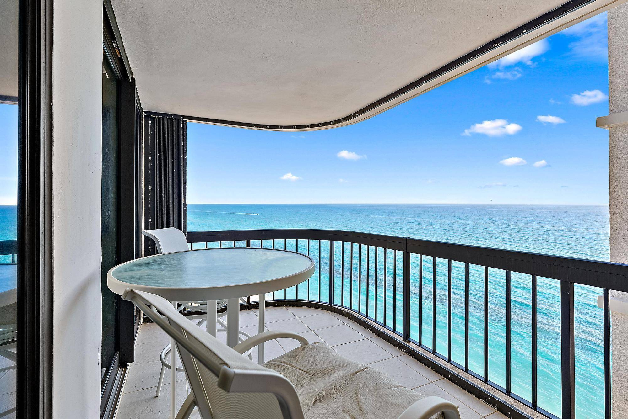 IMPACT WINDOWS ! Take in breathtaking direct oceanfront views from your expansive balcony.