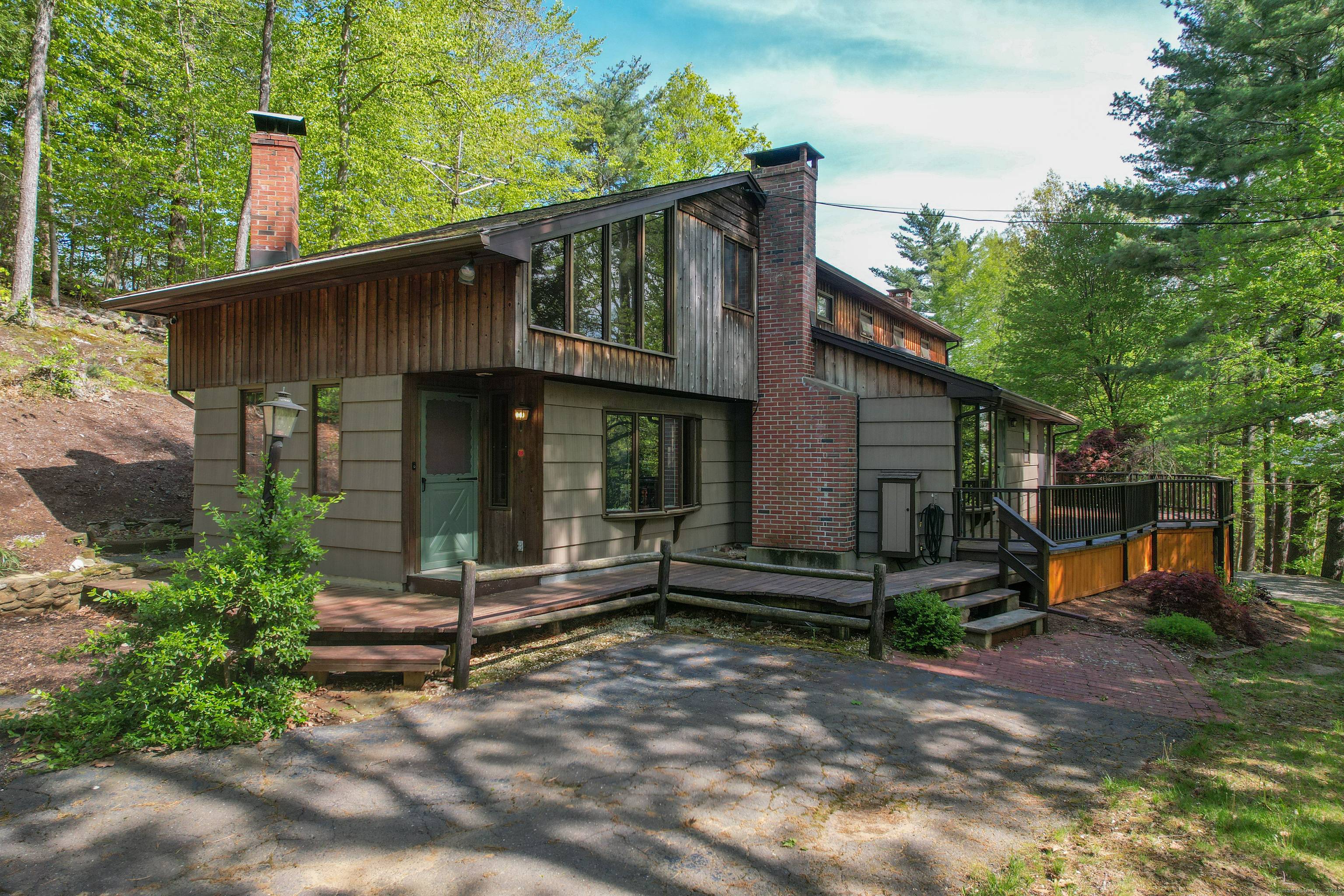 Versatile 3 Bed Contemporary Ranch w Expansive Workshop 2 Car Garage w separate Entrance Additional 2 Car Garage w large Walk Up Storage Area !