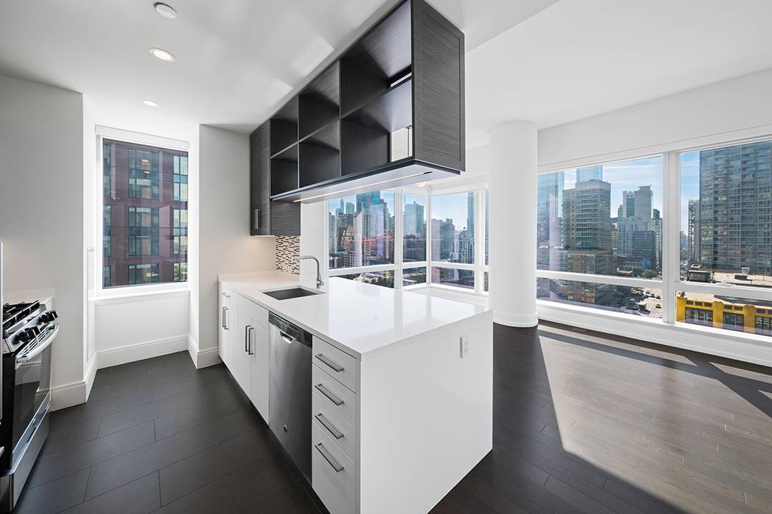 With sweeping views of the city from sunrise to sunset 555TEN towers over the new West Side.